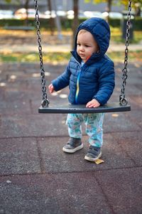 Portrait of sweet little boy on playground