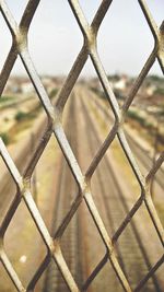 Full frame shot of chainlink fence against sky