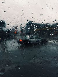 Road seen through wet glass