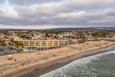 City of imperial beach with people enjoying beach and surf. drone photo