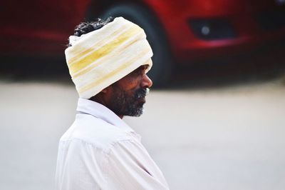 Close-up of man wearing turban while standing outdoors