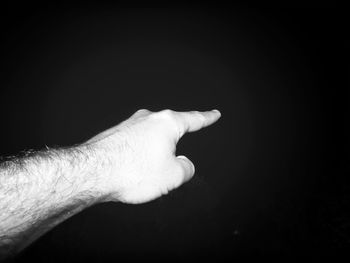 Close-up of hands over black background