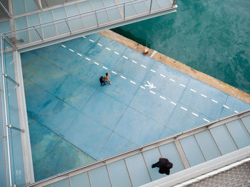 High angle view of people on swimming pool