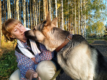 Portrait of boy playing with dog