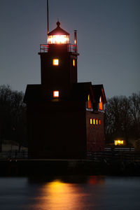 Illuminated building against sky at night