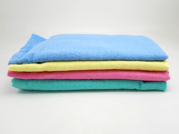 Close-up of multi colored pencils on white background