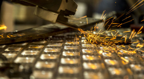 Close-up of metal being cut with handsaw