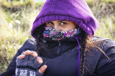 Close-up portrait of woman in warm clothing