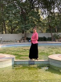 Portrait of a woman standing in swimming pool