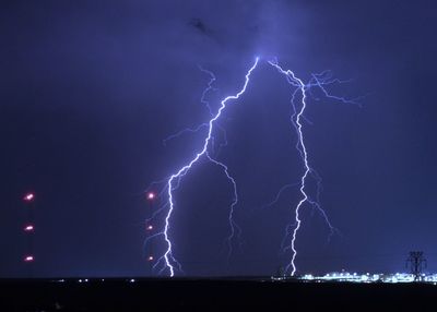 Low angle view of lightning against sky