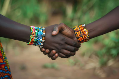 Cropped hand of woman holding hands