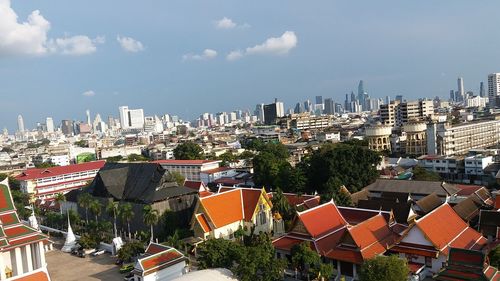 High angle view of buildings in city against sky