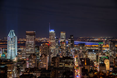 Illuminated buildings in city at night