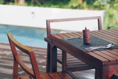 Close-up of empty bench on table