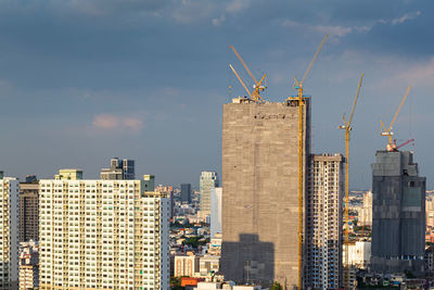 Buildings in city against sky