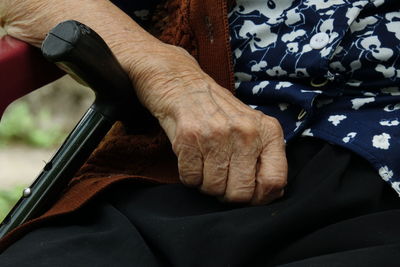 Midsection of man sitting on floor