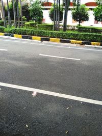 Empty road with city in background