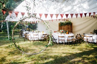 Chairs and table in field in celebrating 