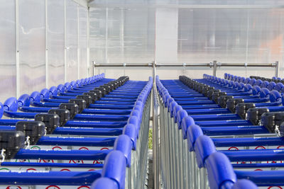 Row of shopping carts at supermarket