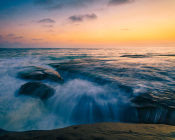 Scenic view of sea against sky during sunset