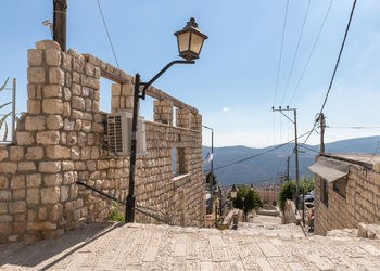 Street amidst buildings against sky