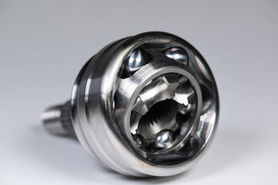 Close-up of machine part on white background