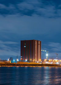 Illuminated city at waterfront