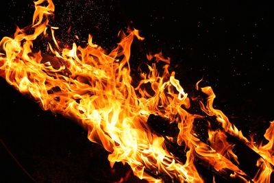 Close-up of bonfire against sky at night