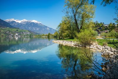 Scenic view of lake against blue sky