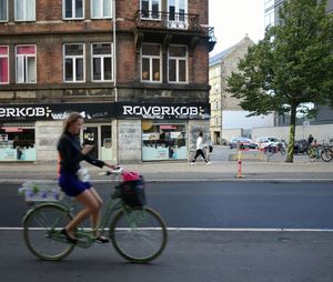 People riding bicycle on road