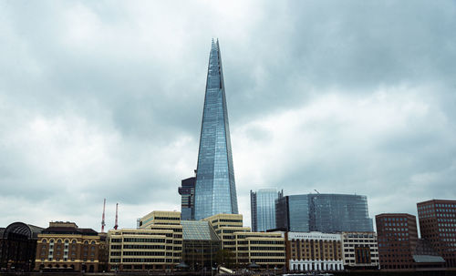 Modern buildings in city against sky