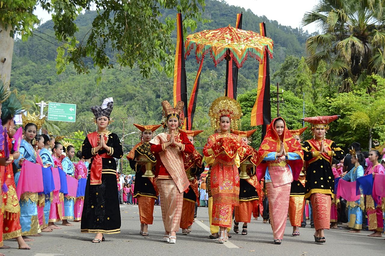 group of people, crowd, tradition, large group of people, arts culture and entertainment, traditional clothing, celebration, festival, clothing, performance, tree, event, dancing, men, plant, full length, day, adult, women, nature, traditional festival, outdoors, costume, parade, religion, multi colored
