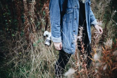 Midsection of woman in grass