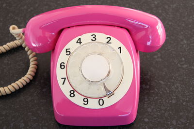 Close-up of telephone on table