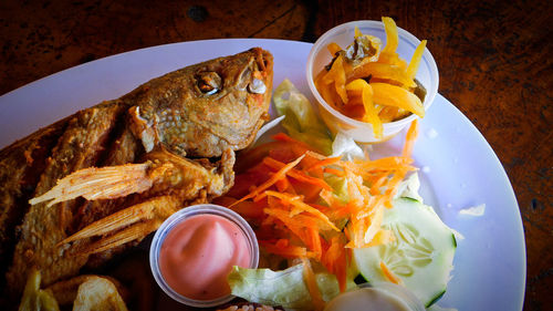 High angle view of fish in plate on table