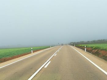 Empty road against sky