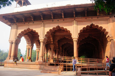 People at historical building