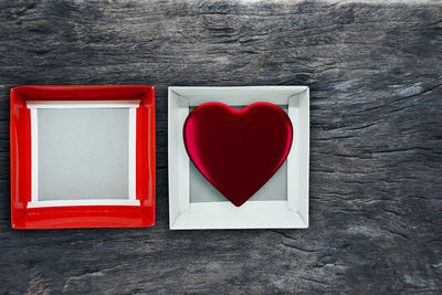 Directly above shot of red heart shape on table