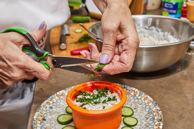 Midsection of man preparing food