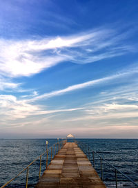 Pier over sea against sky