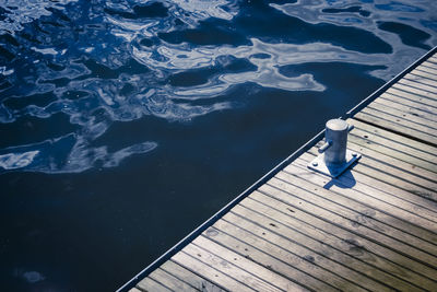 High angle view of pier by lake on sunny day