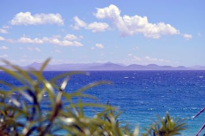 Scenic view of sea against blue sky