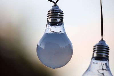 Low angle view of illuminated light bulb