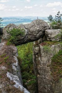 Scenic view of rocks on land against sky