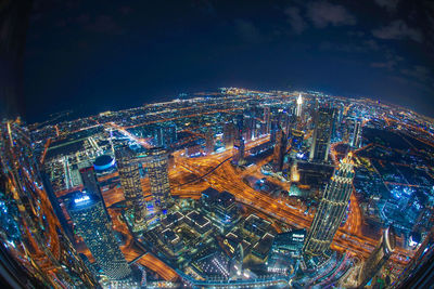 High angle view of illuminated buildings in city at night