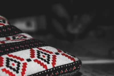 Low section of person wearing canvas shoes