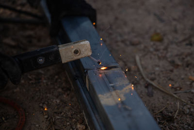 High angle view of burning candles on metal