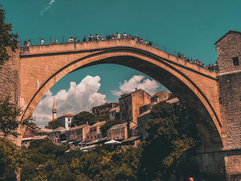 Low angle view of arch bridge against sky