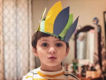 Portrait of cute boy wearing crown