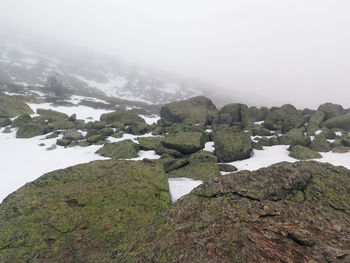 Scenic view of mountains against sky during winter